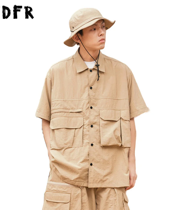 Camisas Cargo de Color liso con bolsillo para hombre, camisas informales de manga corta estilo Safari, camisas holgadas de media manga con un solo pecho