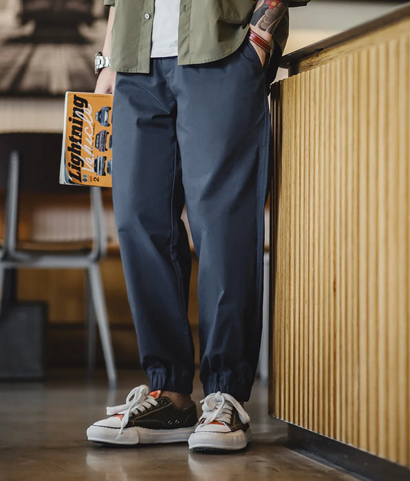 Pantalones cónicos casuales de sarga elástica 100% algodón Pantalones deportivos con puños y cintura elástica de color caqui